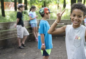 Boy smiling enjoying camp