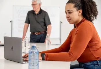 Woman at computer in classroom