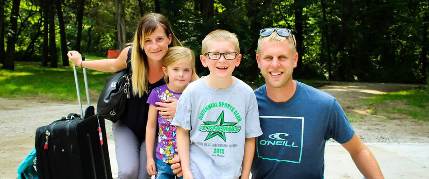 Family arriving at Camp Henry
