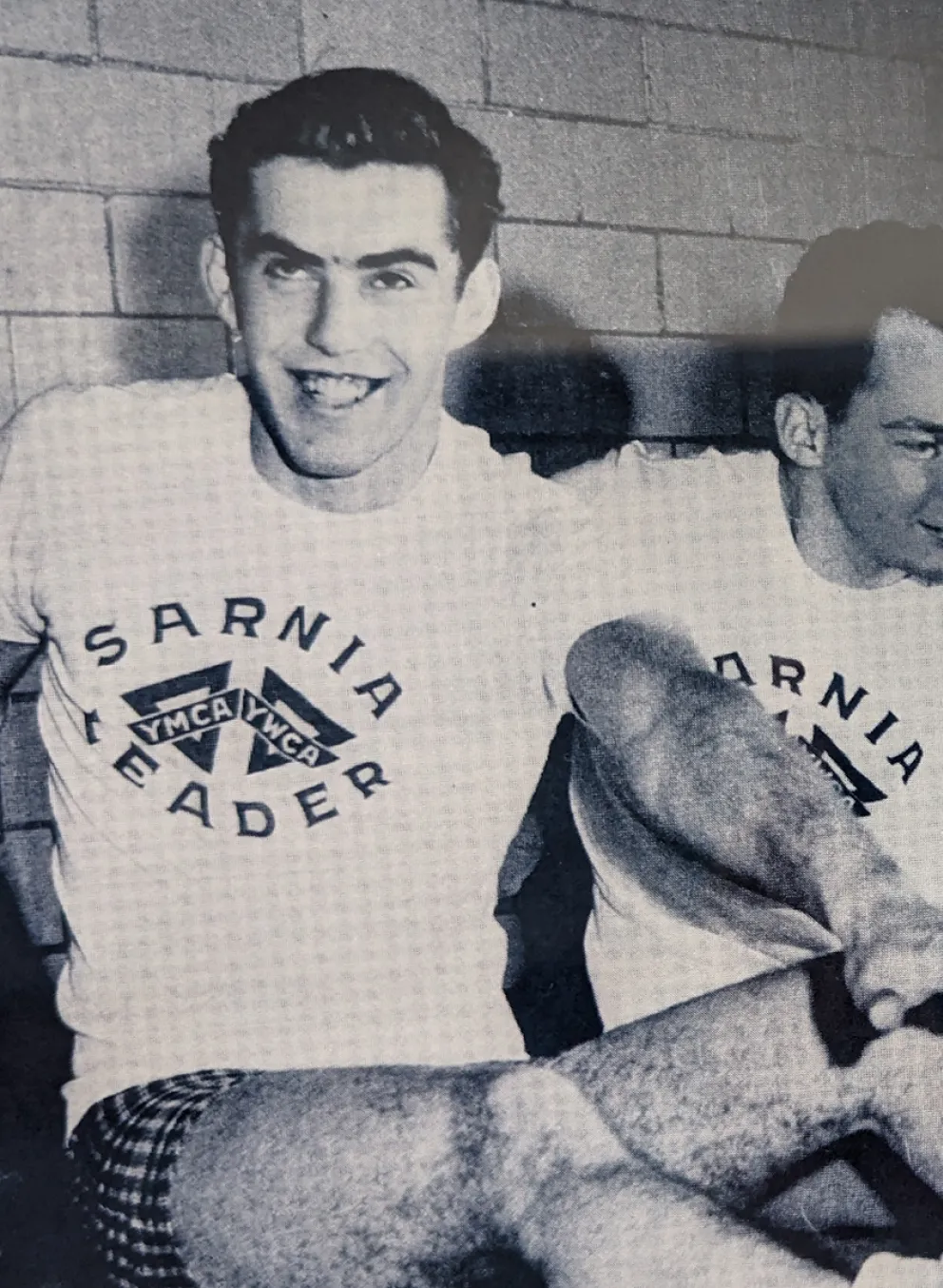 Four men streatching in historic photo
