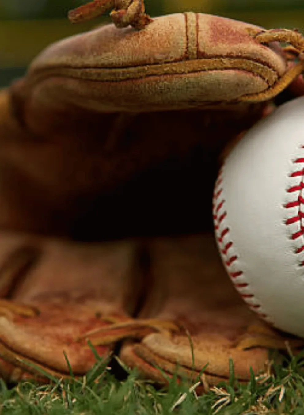 Baseball glove with London Majors ball in it