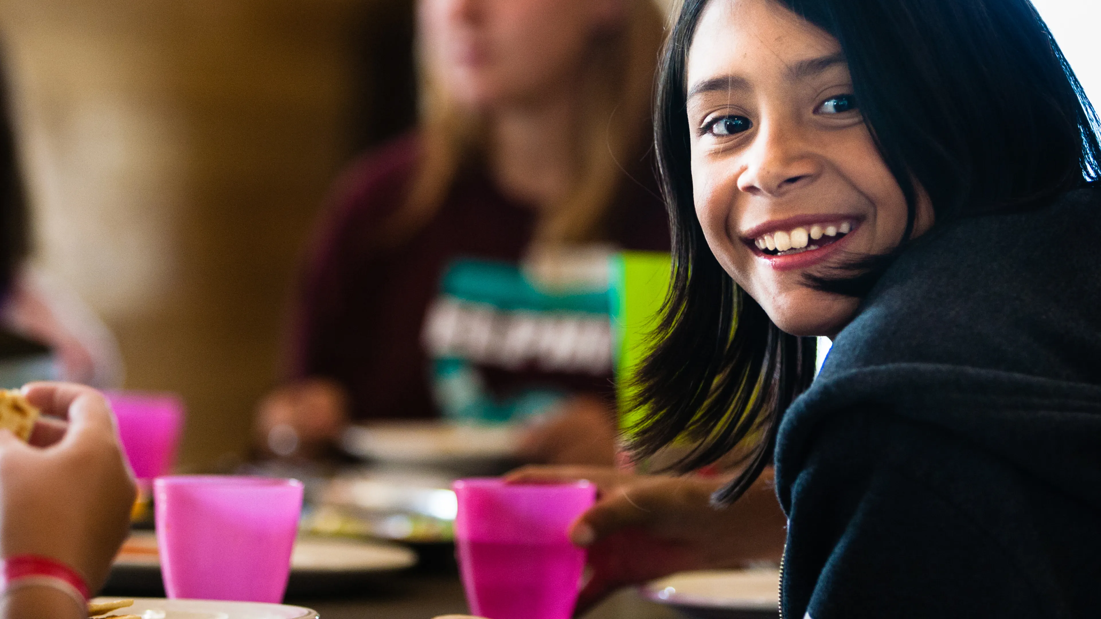 Kids eating snacks at a table