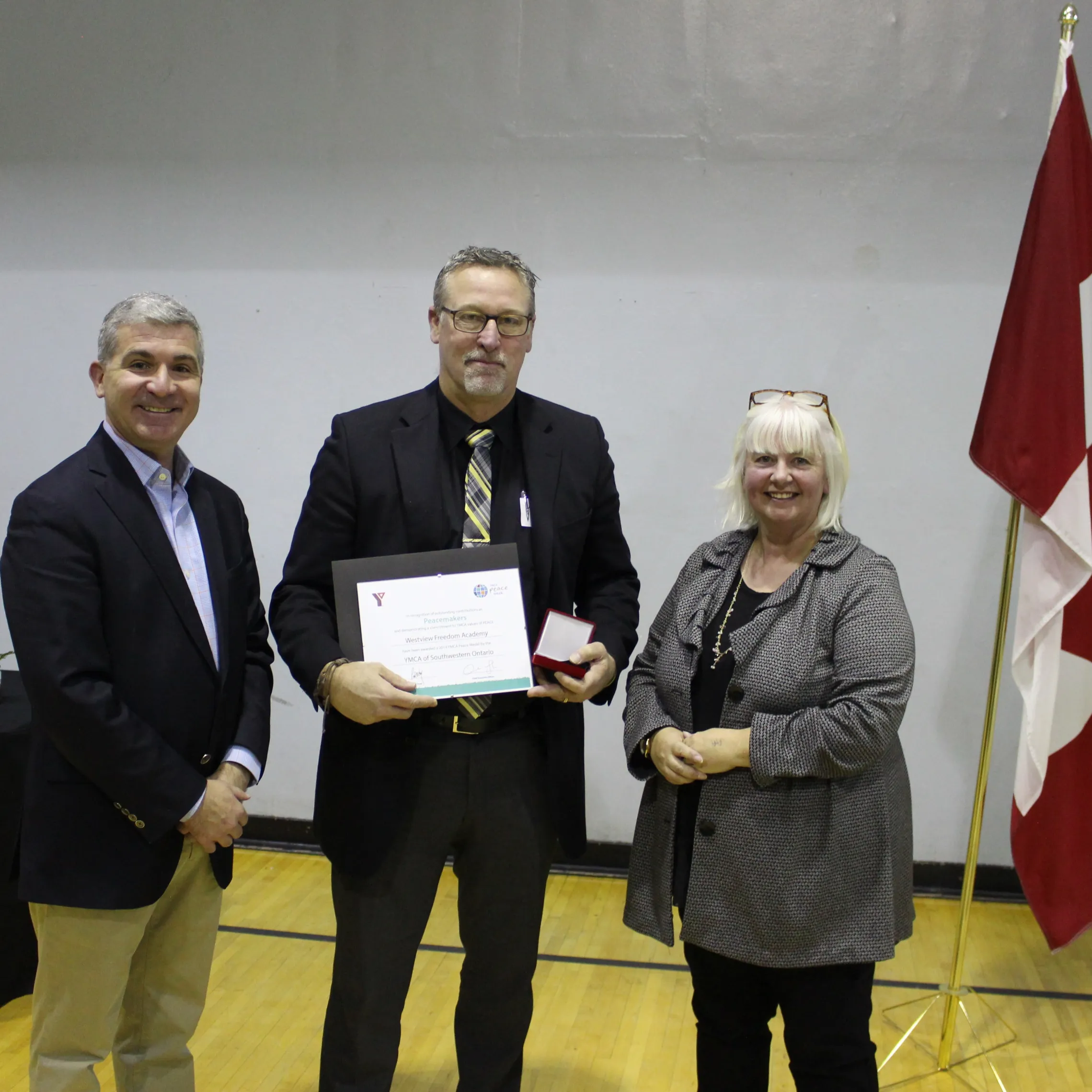 A representative from Westview accepts their award.