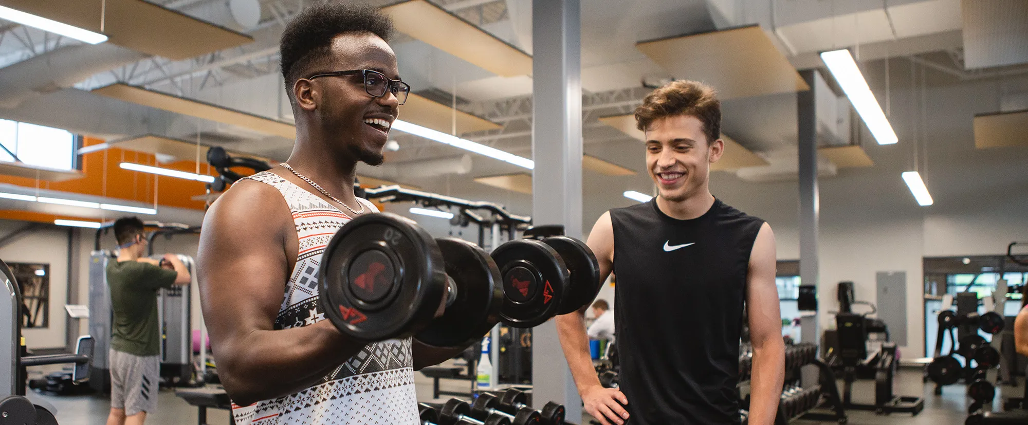 Two teens lifting weights