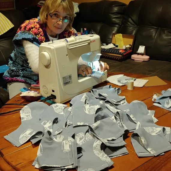 Matgorzata sews masks as part of the newcomer sewing group.
