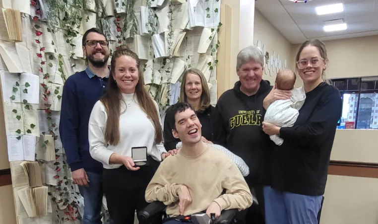 Rachel Guerin - 2025 Peace Week Recipient standing with group of smiling people