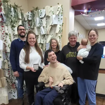 Rachel Guerin - 2025 Peace Week Recipient standing with group of smiling people