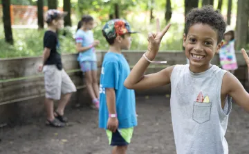 Boy smiling enjoying camp