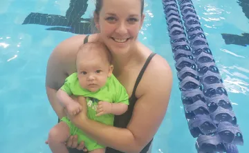 Julie holds her 4 month old son Joey in the St. Thomas YMCA pool.